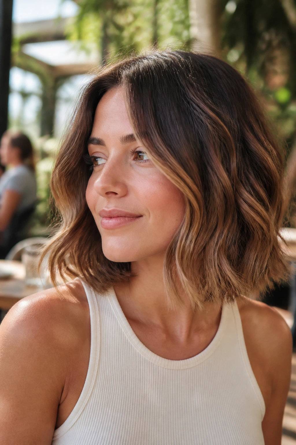 Close-up portrait of a real woman with wavy lob and disconnected ends