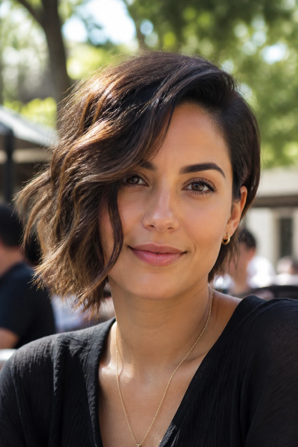 Portrait of a person with a wavy one-side bob leaning to one side