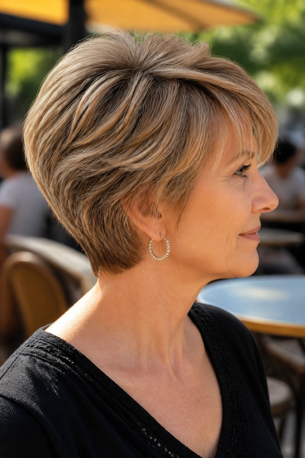 Profile portrait of a woman with wedge haircut highlighting stacked crown and back view